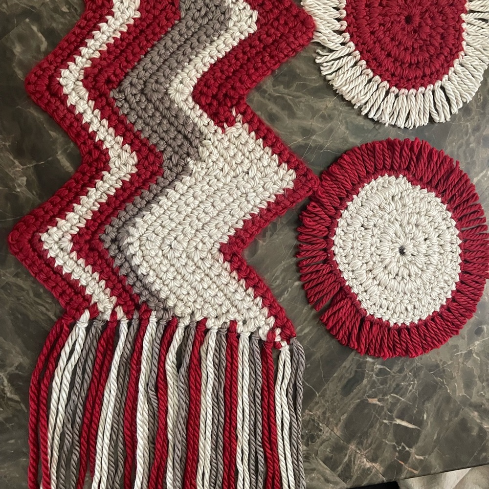 Hand crocheted table runner with coasters.